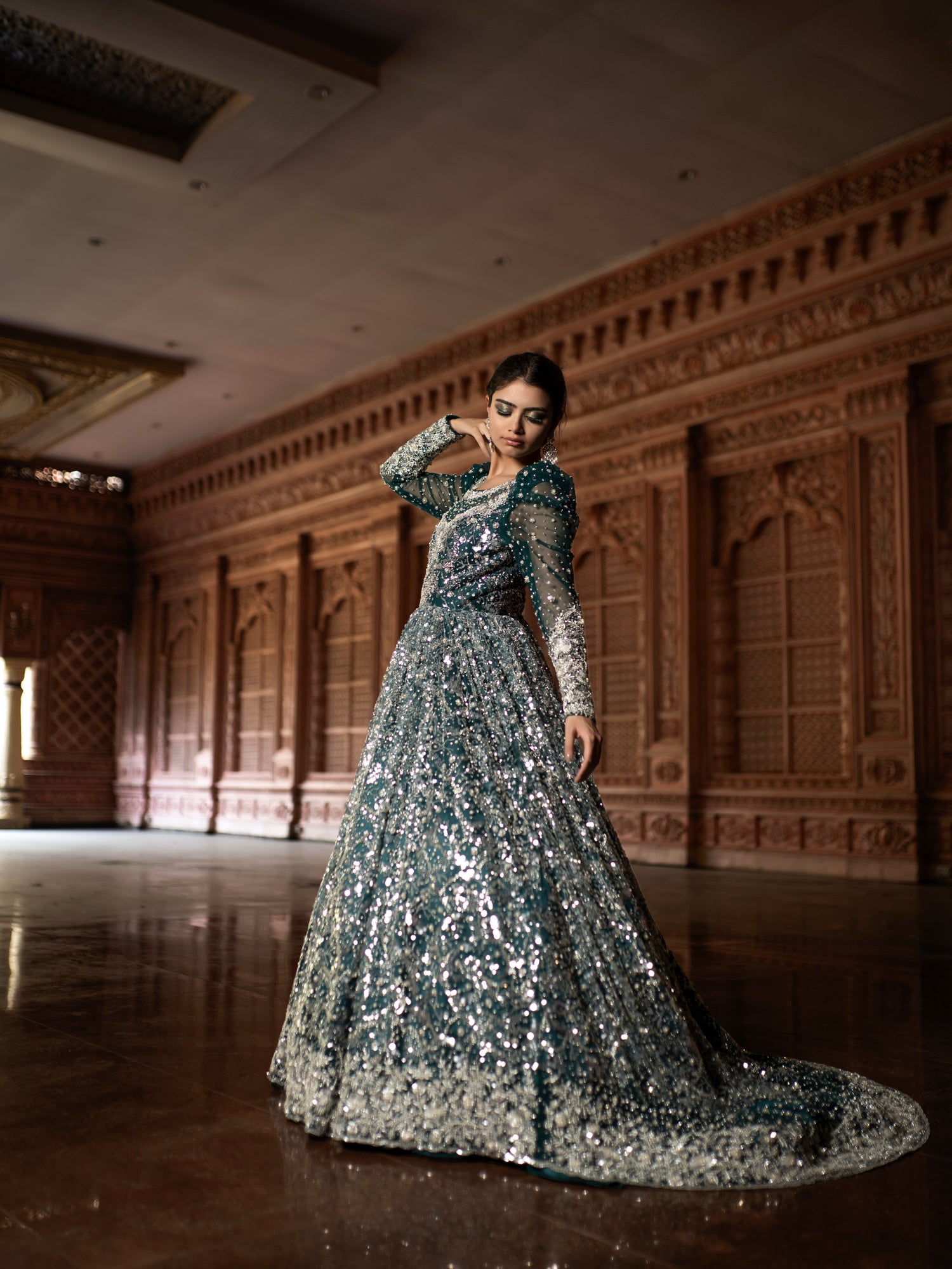 Emerald green sequin trail gown.